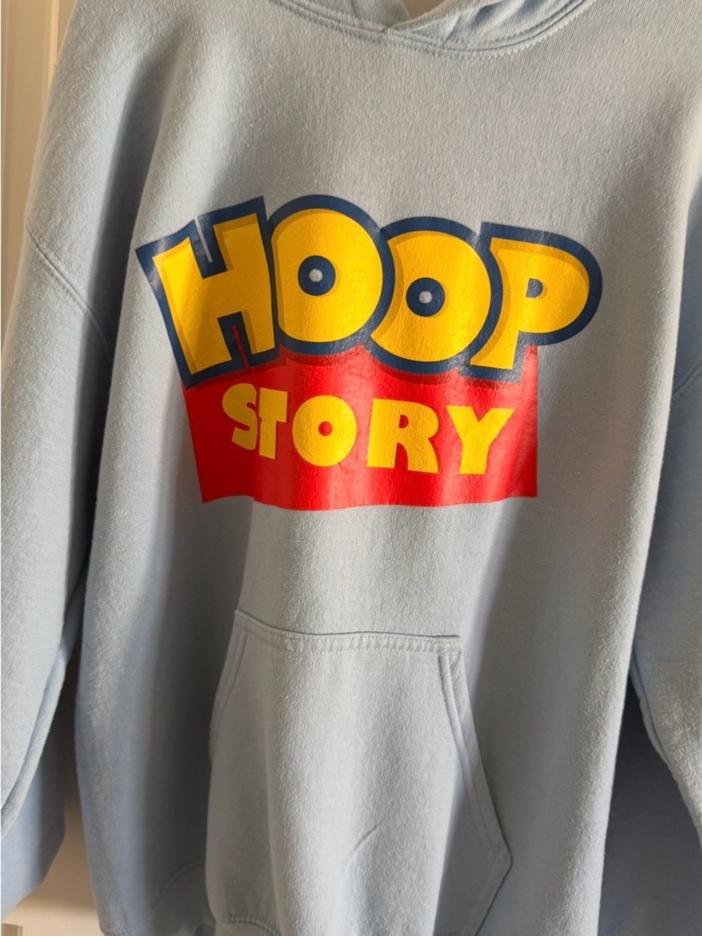 Bucket Culture Hoop Story pullover hoodie in light blue, size Small.